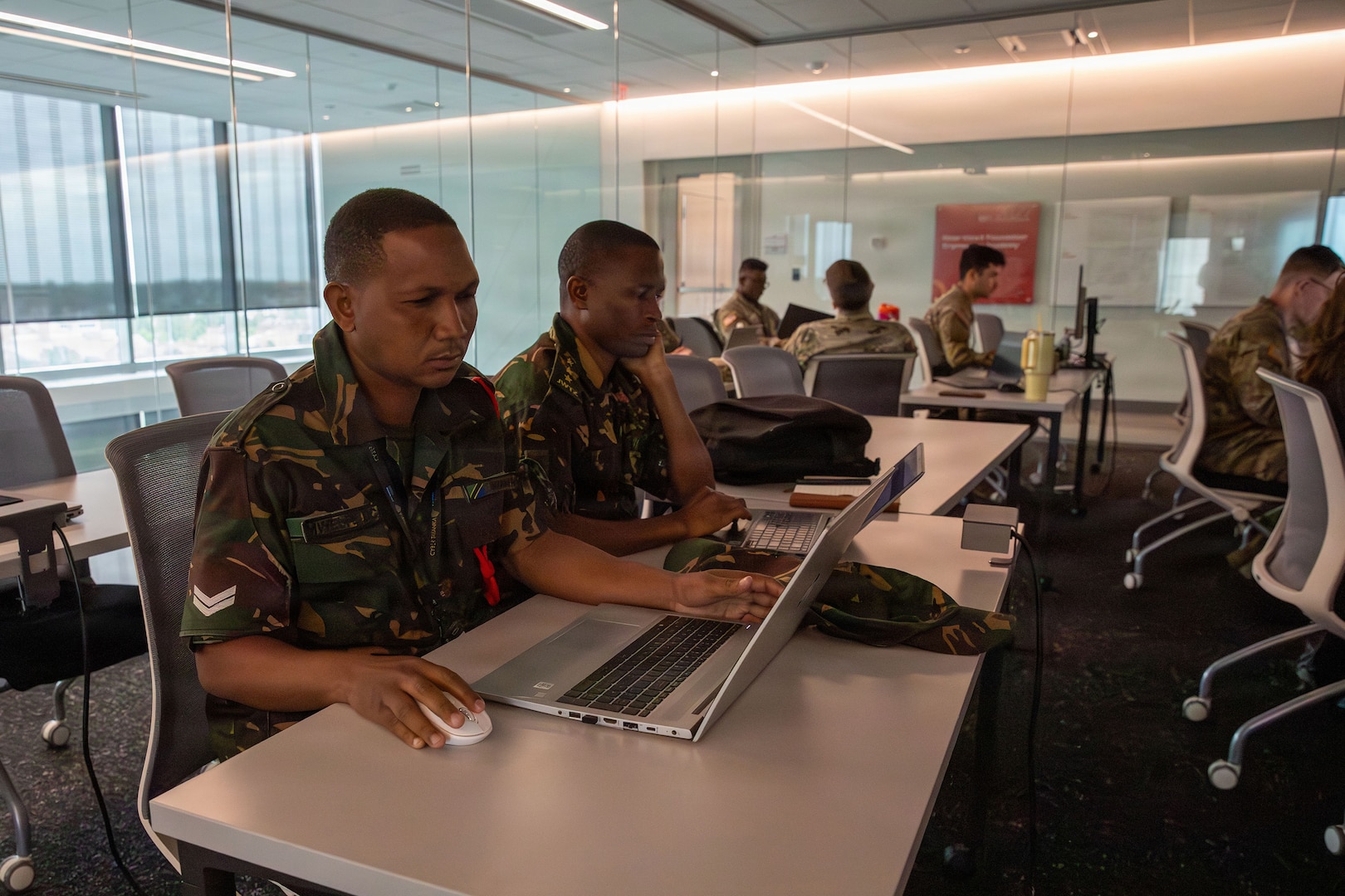 Service members from the Armed Forces of Tanzania analyze defensive data logs on a laptop during the live-fire phase of Exercise Cyber Tatanka 2026 at Kiewit Hall on the University of Nebraska-Lincoln campus in Lincoln, Nebraska, June 9, 2026.
