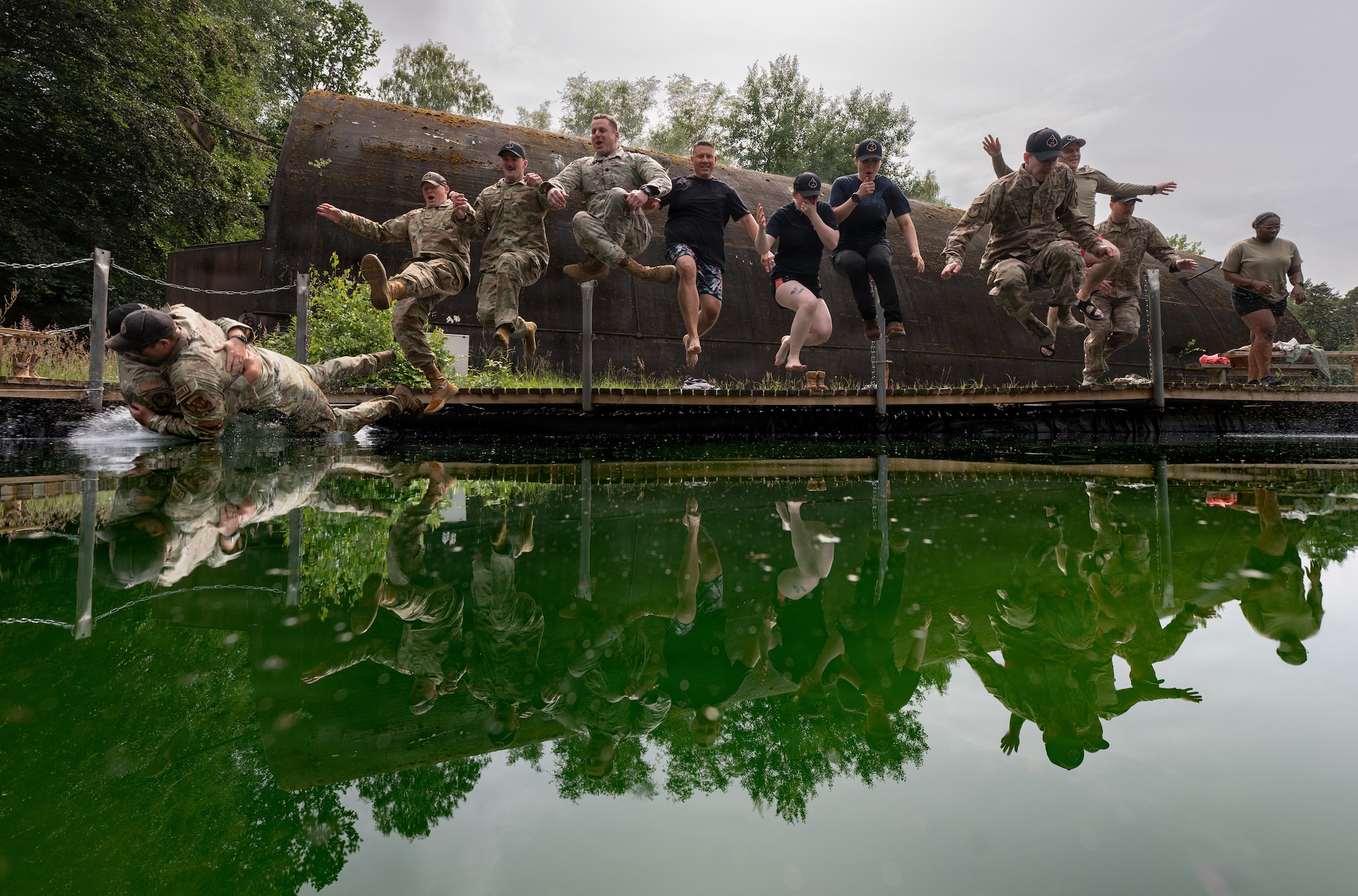 people jump into pool