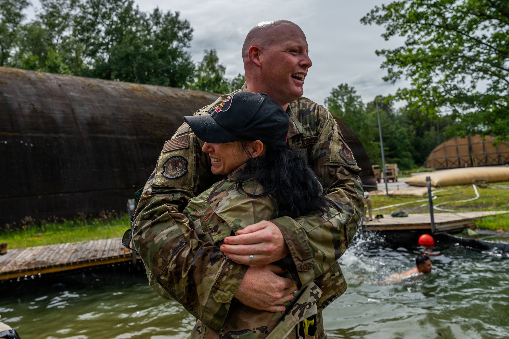 man hugs woman