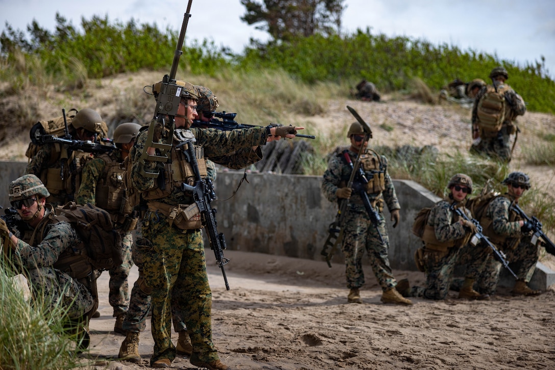 U.S. Marine Corps Cpl. Zachary Arnett, center left, a combat engineer with Combat Logistics Battalion 24, Combat Logistics Regiment 27, 2nd Marine Logistics Group, prepares Marines to sweep for improvised explosive devices during exercise Baltic Operations 26 in Ventspils, Latvia, June 12, 2026. BALTOPS 2026, the premiere maritime-focused exercise in the Baltic Region, provides a unique training opportunity to strengthen combined response capabilities critical to preserving freedom of navigation and security in the Baltic Sea. Arnett is a native of Colorado. (U.S. Marine Corps photo by Lance Cpl. Brady Hathaway)