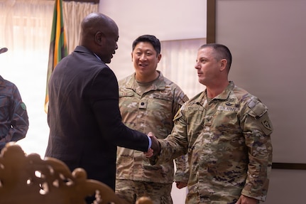 U.S. Army Col. Patrick J. Szvetitz, North Carolina National Guard Joint Force Headquarters director of strategic plans and policy, right, shakes hands with Maambo Haamaundu, Zambia Ministry of Defence permanent secretary, left, at the Zambia Army Headquarters, Lusaka, Zambia, June 8, 2026.