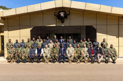 U.S. Army Soldiers assigned to the North Carolina National Guard and representatives from the Botswana Defence Force, Malawi Defence Force, Zambian Defence Force, Zambia National Service and National Disaster Risk Mangement Division, pose for a group photo with the guest of honor, Norman Chipakupaku, National Disaster Risk Management Division national coordinator, center, at the Zambia Army Headquarters, Lusaka, Zambia, June 12, 2026.