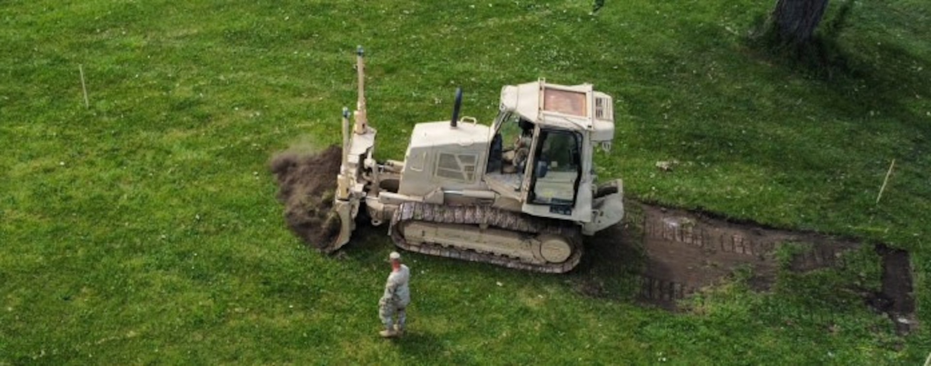 Soldiers from the Illinois Army National Guard’s 123rd Engineer Battalion do grubbing operations at the Crestwood Armory as they install a running track as part of their annual training in June 2026.