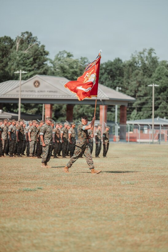 U.S. Marine Corps Sgt. Maj. Ralph C. Vargas, Marine Forces Special Operations Command sergeant major  brings the MARSOC colors to Maj. Gen. Peter D. Huntley during the change of command ceremony on Marine Corps Base Camp Lejeune, North Carolina, June 12, 2026. During the ceremony, Maj. Gen. Peter D. Huntley relinquished command of MARSOC to Maj. Gen. Michael A. Brooks, a tradition symbolizing the transfer of authority, responsibility and accountability of the Marines and Sailors under his charge. (U.S. Marine Corps photo by Lance Cpl. Jared Saul)
