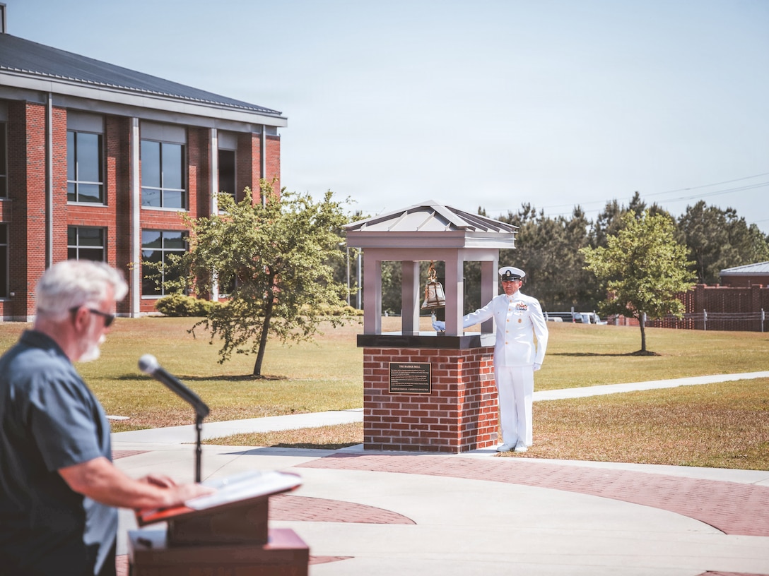 U.S. Navy Master Chief John Leasiolagi, Command Master Chief, Marine Forces Special Operations Command, rings the bell at the Bell Dedication Ceremony during heritage week at Marine Corps Base Camp Lejeune, North Carolina, April 24, 2025. MARSOC celebrates the 20th anniversary of the command's activation after Secretary of Defense, Donald Rumsfeld, directed the creation of a Marine Corps component inside United States Special Operations Command Feb. 24, 2006. (U.S. Marine Corps photo by Lance Cpl. Jared Saul)