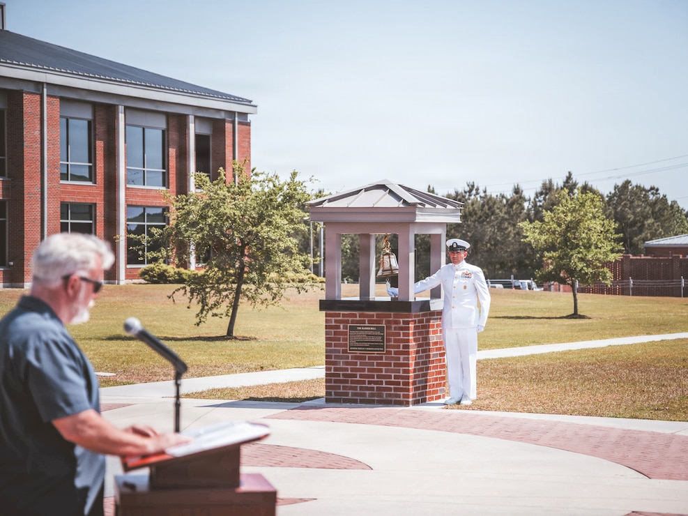 U.S. Navy Master Chief John Leasiolagi, Command Master Chief, Marine Forces Special Operations Command, rings the bell at the Bell Dedication Ceremony during heritage week at Marine Corps Base Camp Lejeune, North Carolina, April 24, 2025. MARSOC celebrates the 20th anniversary of the command's activation after Secretary of Defense, Donald Rumsfeld, directed the creation of a Marine Corps component inside United States Special Operations Command Feb. 24, 2006. (U.S. Marine Corps photo by Lance Cpl. Jared Saul)
