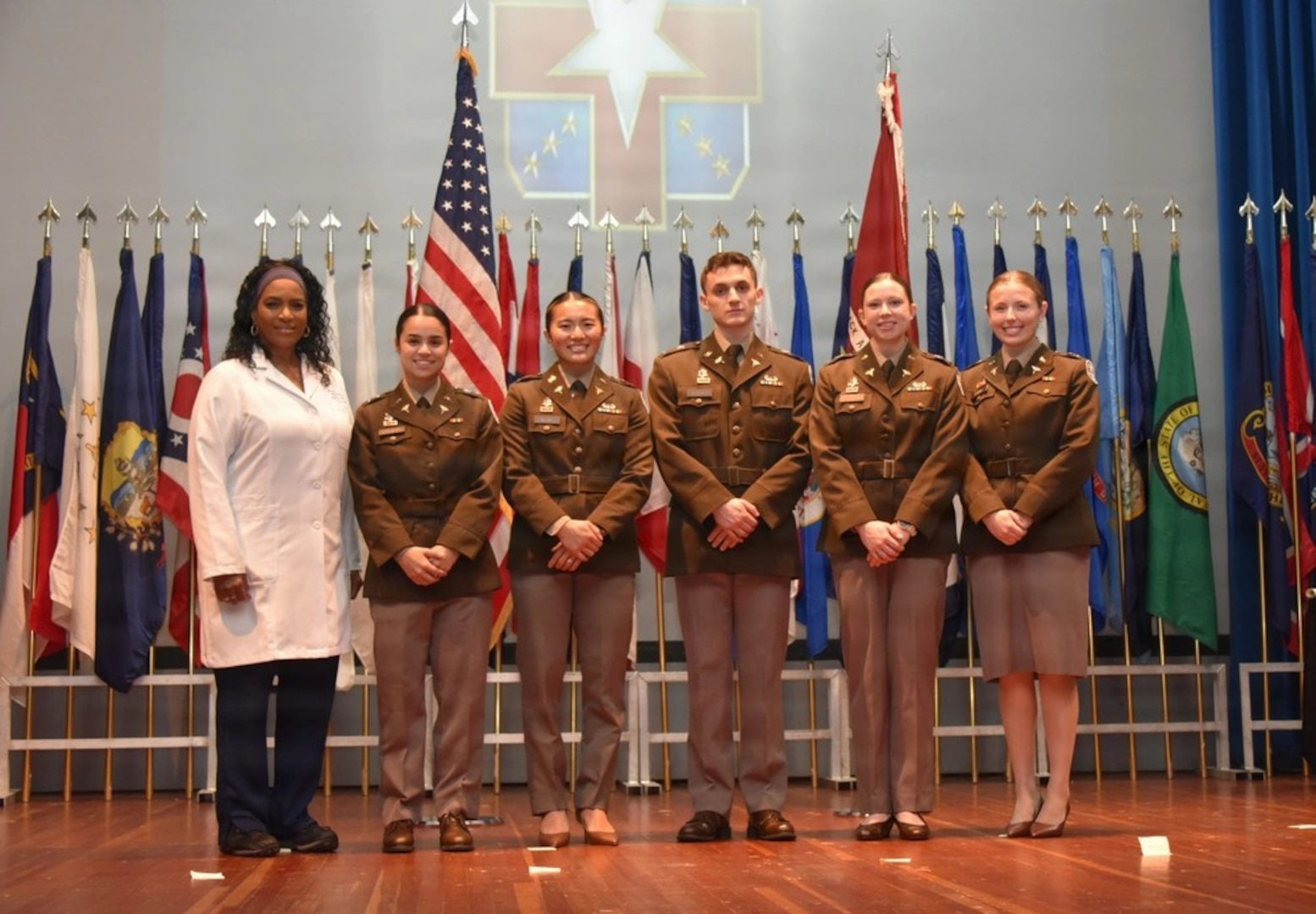 Graduates, family members, and leadership gather during the Womack Army Medical Center Graduate Medical and Graduate Dental Education commencement ceremony at Fort Bragg, N.C., June 5, 2026. The annual event honored a new class of Army physicians, dentists, nurses, and social workers who completed training in nationally accredited programs, preparing them to support military medicine missions worldwide.