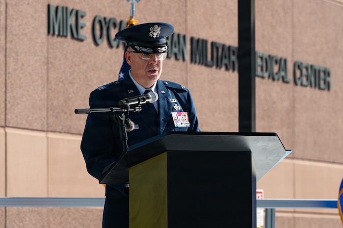 Col. Jason Glynn speaks at a podium.