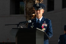 Col. Eric Phillips speaks at a podium.