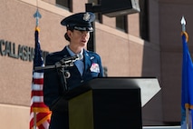 Col. Mary Carnduff speaks at podium.