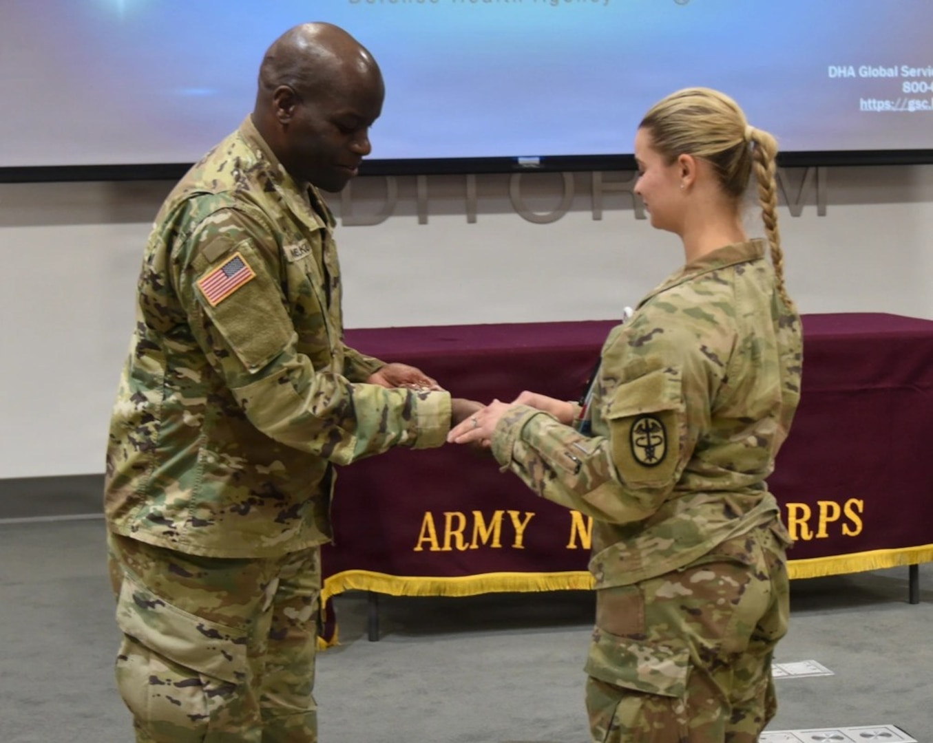 Womack Army Medical Center kicks off Nurses Week with opening ceremony to include the “Blessing of the Hand’s”, a time-honored tradition. U.S. Army Chaplain Ronald Kambuku blesses the hand of a nurse, May 4, 2026, Fort Bragg, North Carolina (Photo by Keisha Frith, Womack Army Medical Center Public Affairs Office)