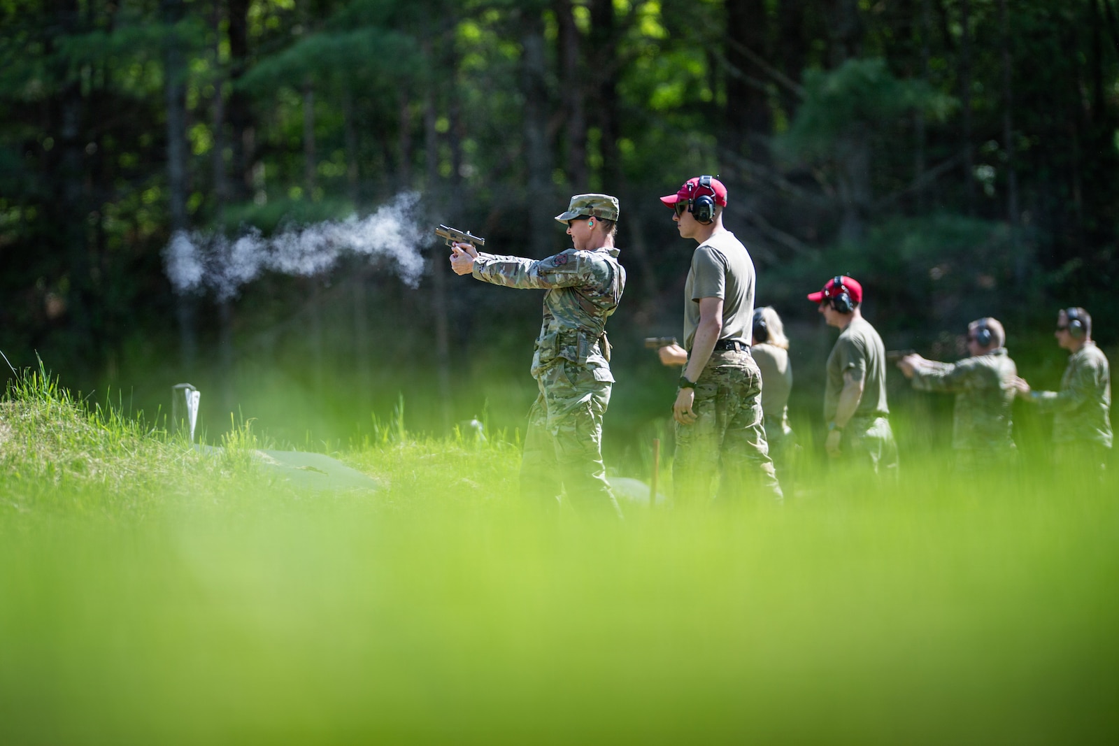 Photo of U.S. Air Force Command Chief Master Sgt. Jillian Rolla, the state command chief master sergeant for the Vermont National Guard, shooting a 9 mm Sig Sauer pistol at the Ethan Allen Firing Range in Jericho, Vermont.