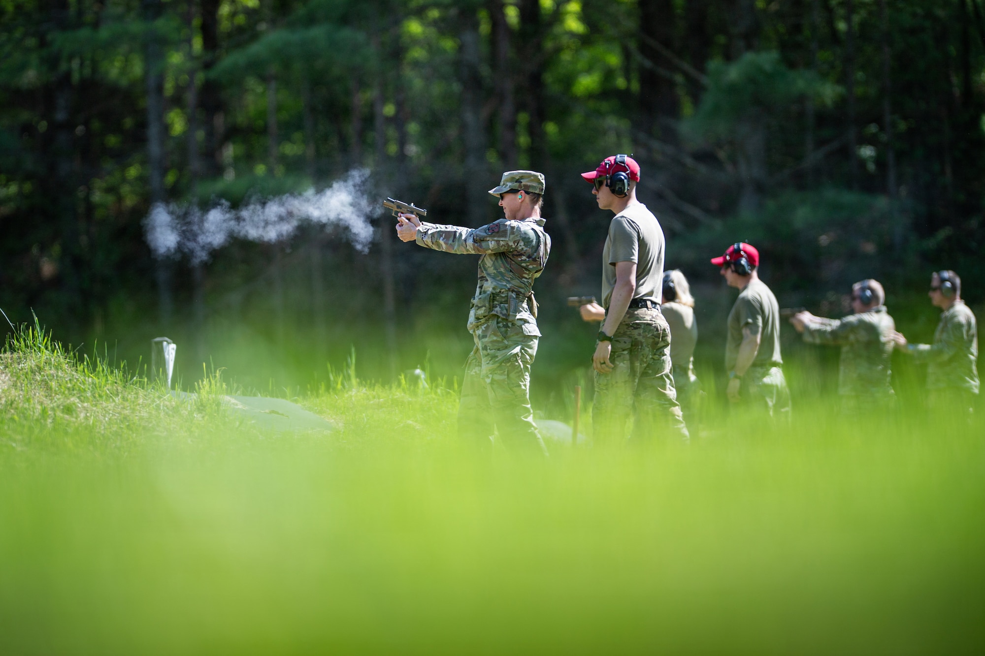 Photo of U.S. Air Force Command Chief Master Sgt. Jillian Rolla, the state command chief master sergeant for the Vermont National Guard, shooting a 9 mm Sig Sauer pistol at the Ethan Allen Firing Range in Jericho, Vermont.