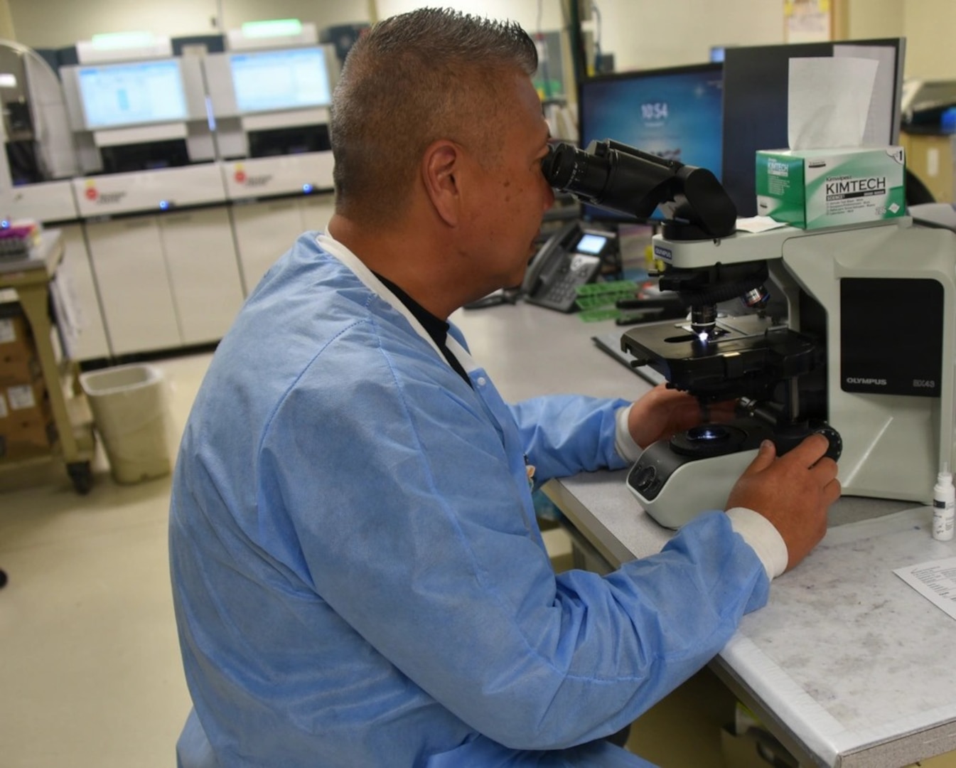 Womack Army Medical Center Hematology technician reviewing a peripheral smear for any blood abnormalities, April 23, 2026, Fort Bragg North Carolina. (Photo by Keisha Frith, Womack Army Medical Center Public Affairs Office)