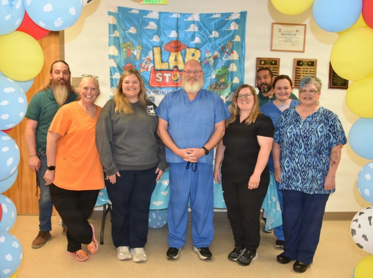 Some members of the Womack Army Medical Center Department of Pathology team pose for a group photo. From analyzing routine blood work to standing by in the operating room, these unseen professionals are responsible for the data that guides critical medical decisions, April 23, 2026, Fort Bragg NC. (Photo by Keisha Frith, Womack Army Medical Center Public Affairs Office
