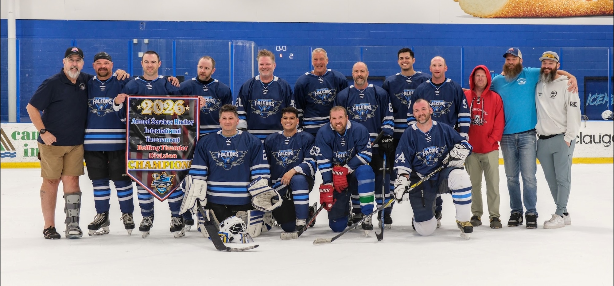Players from the Hill hockey program pose with their first-place banner at the Armed Services Hockey Tournament in Jacksonville, Fla., May 25, 2026.