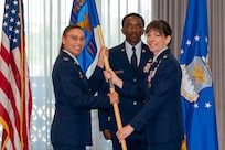 11th Wing Mission Support Group commander receives guidon from outgoing 11th Wing Logistics Readiness Squadron commander.