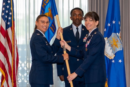 11th Wing Mission Support Group commander receives guidon from outgoing 11th Wing Logistics Readiness Squadron commander.