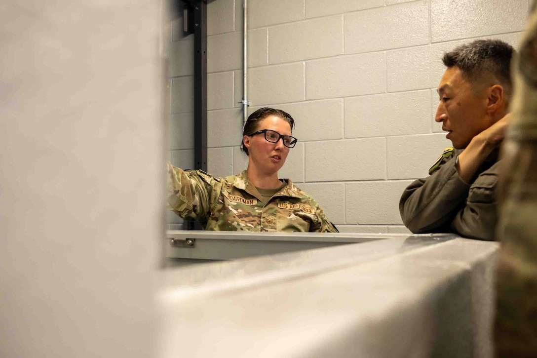 Service member is recognized for her work with military working dog facility.