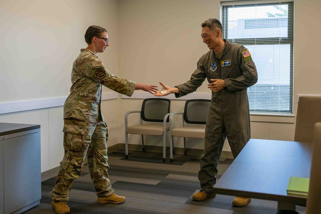 Service member is recognized for her work with military working dog facility.
