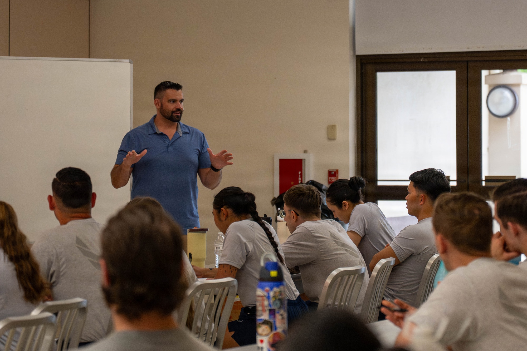 David Pierson, Patrick Air Force Base operational support team specialist, briefs Airmen at Joint Base Pearl Harbor-Hickam, June 5, 2026. Pierson is one of the members who wrote the curriculum for the Master Fitness Leader course taught across the Air Force. (U.S. Air Force photo by Senior Airman Lauren Torres)