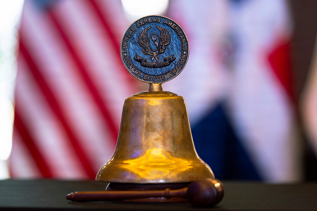 The System of Cooperation Among the American Air Forces (SICOFAA) ceremonial bell sits on a table during the 66th annual Conference of the American Air Chiefs (CONJEFAMER) in Punta Cana, Dominican Republic, June 16, 2026. The conference highlights more than six decades of cooperation among American air forces through SICOFAA and remains the premier forum for allied and partner nations to strengthen interoperability and improve coordination in response to shared regional challenges. (U.S. Air Force photo by Tech. Sgt. Rachel Maxwell)