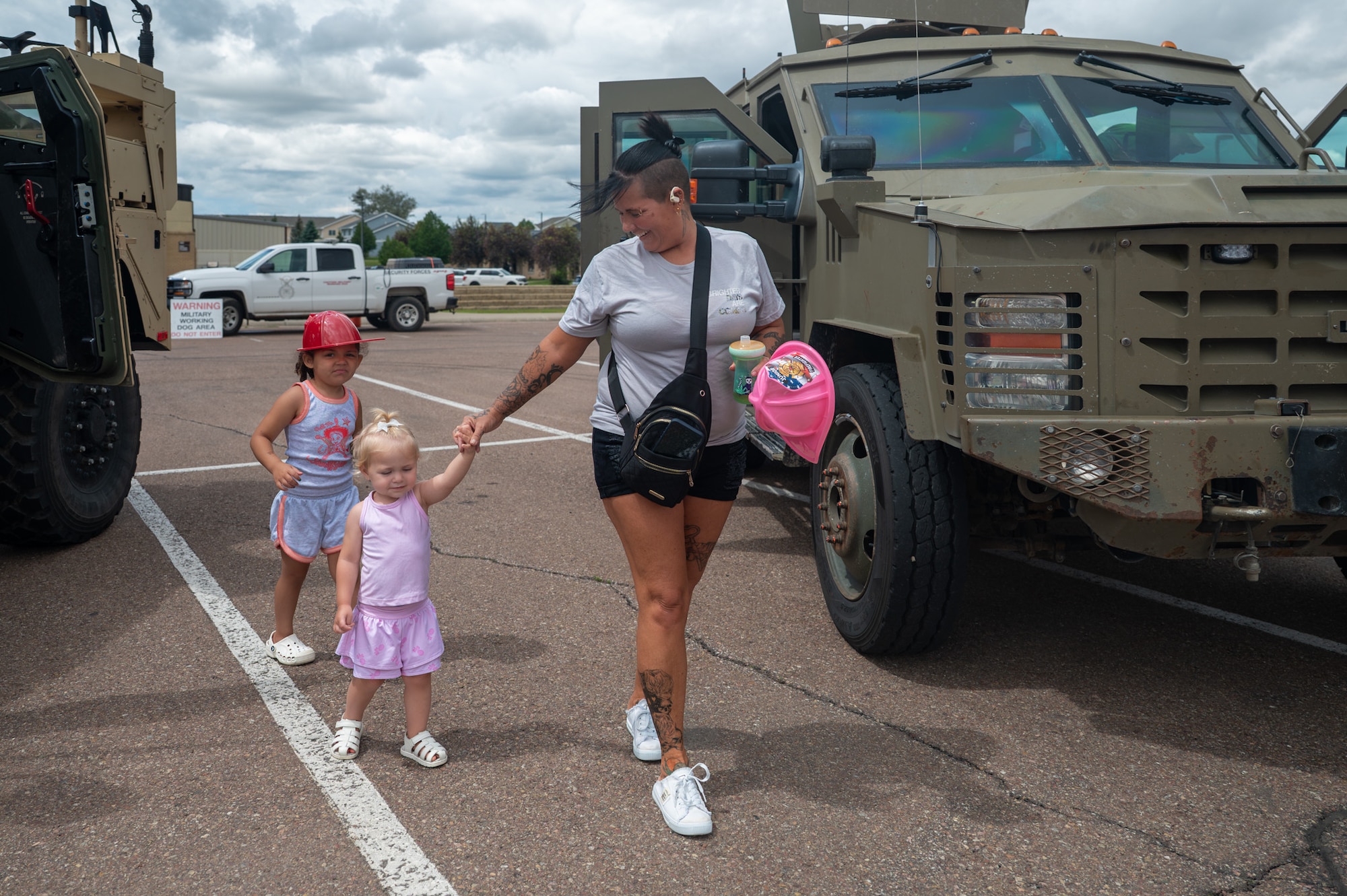 A mom walks with her two daughters.