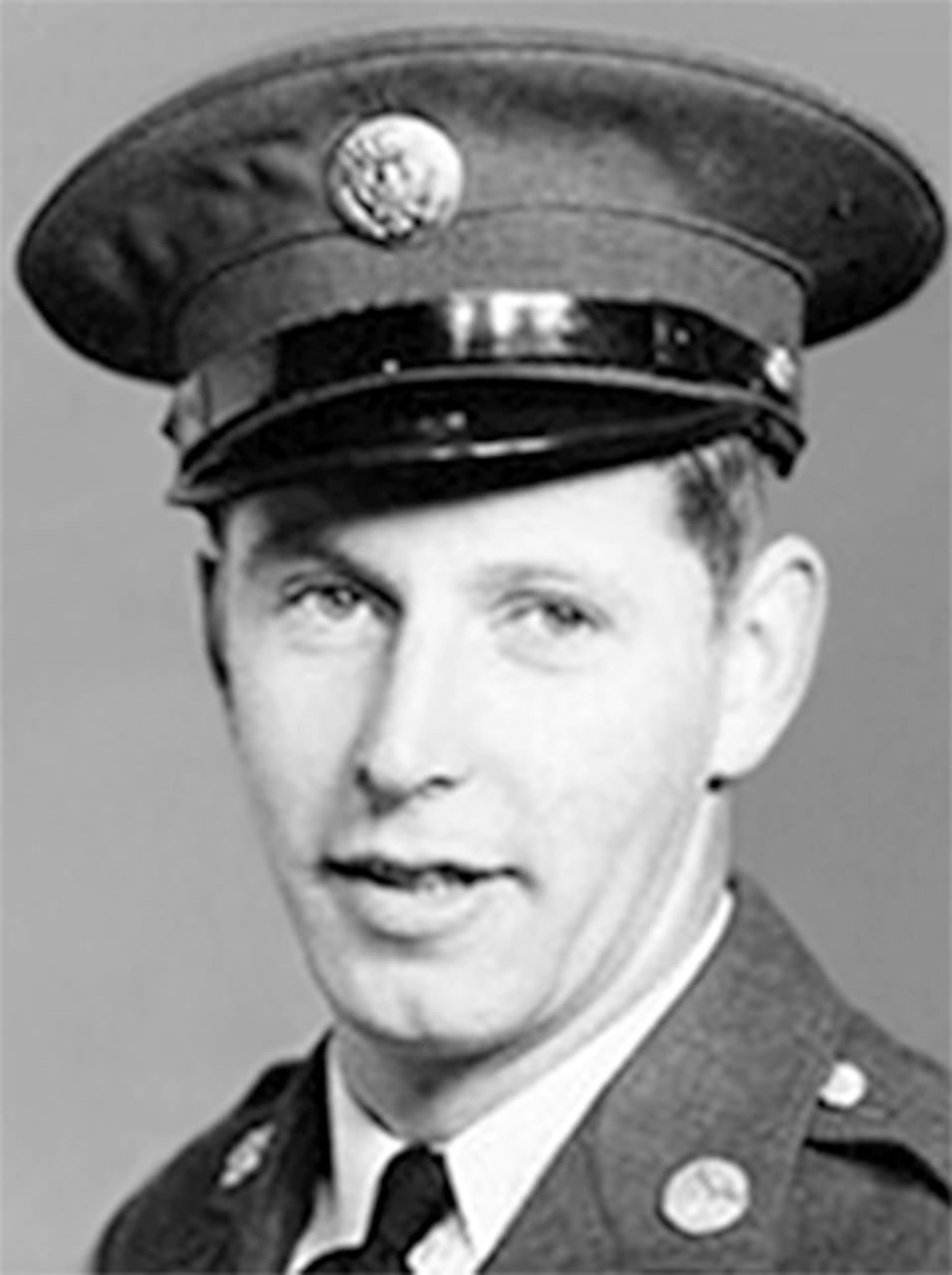 A man in a formal military uniform.