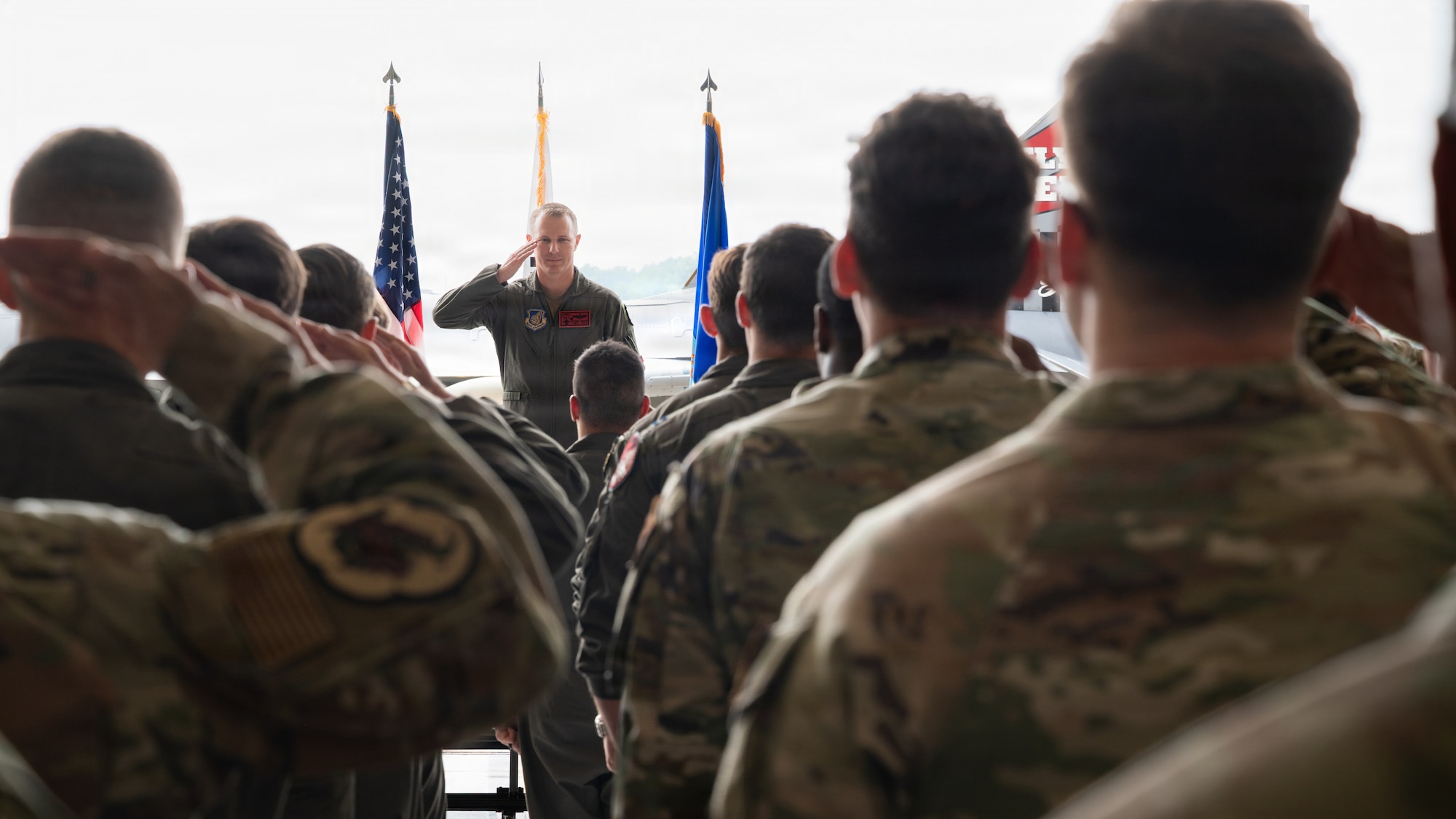 A squadron salutes their new commander.