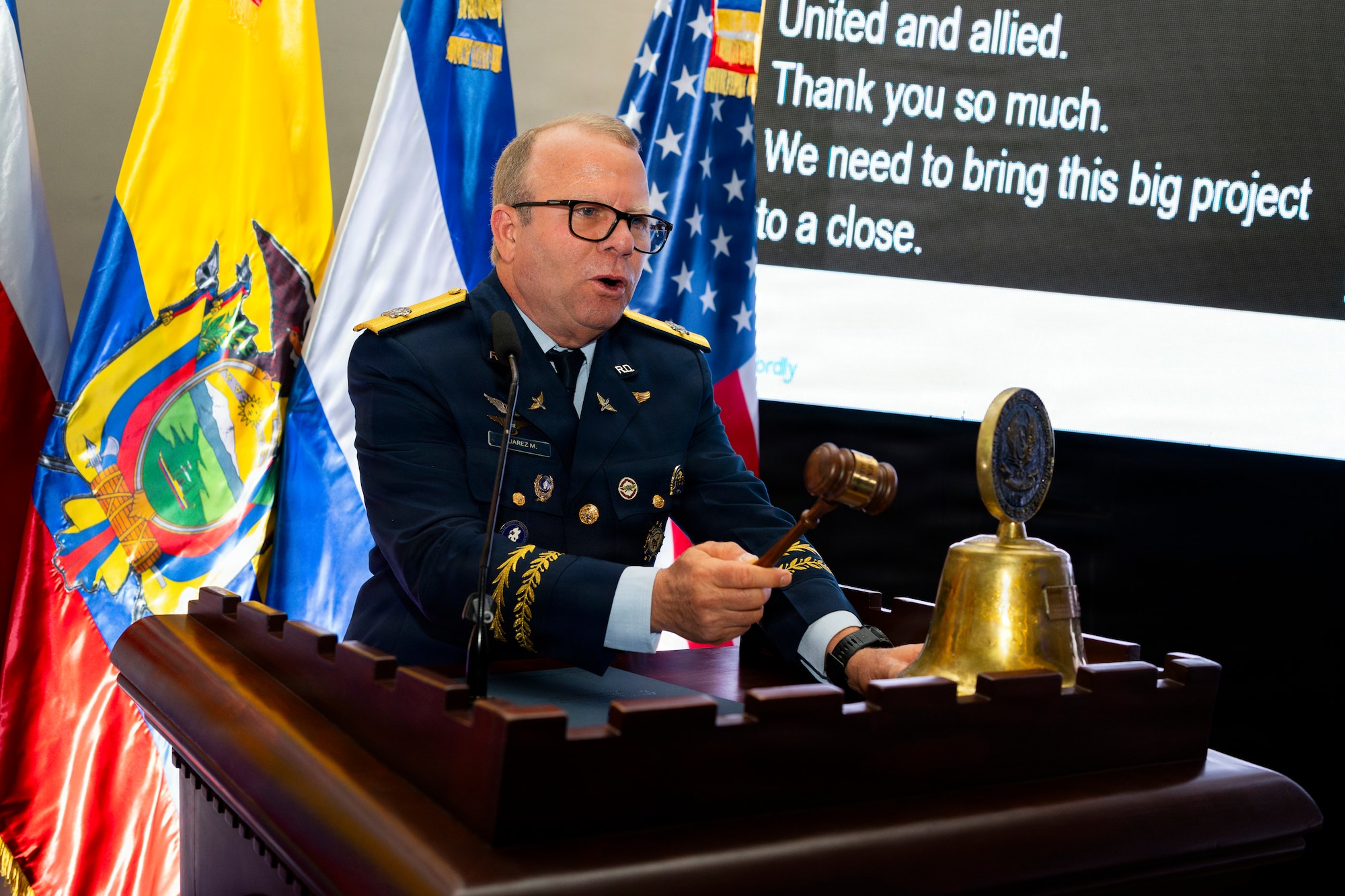 Maj. Gen. Floreal T. Suárez Martínez, commanding general of the Dominican Republic air force, rings the System of Cooperation Among the American Air Forces (SICOFAA) ceremonial bell, signifying the conclusion of the 66th annual Conference of the American Air Chiefs (CONJEFAMER) in Punta Cana, Dominican Republic, June 17, 2026. As host nation, Martínez served as CONJEFAMER president and oversaw the conference's official proceedings, which were dedicated to the exchange of experiences, knowledge and training to strengthen the collective capabilities of air forces across the Western Hemisphere. (U.S. Air Force photo by Tech. Sgt. Rachel Maxwell)