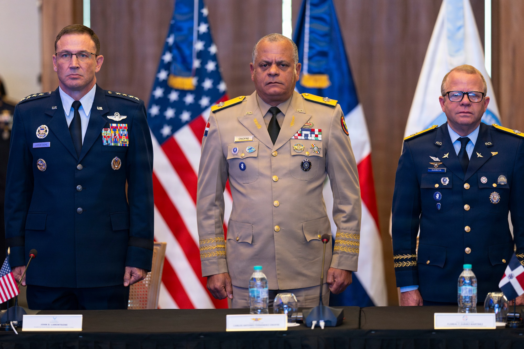 Army Lt. Gen. Carlos Antonio Fernández Onofre, minister of defense of the Dominican Republic, center, stands alongside U.S. Air Force Vice Chief of Staff Gen. John D. Lamontagne, left, and Maj. Gen. Floreal T. Suárez Martínez, commanding general of the Dominican Republic air force, during the playing of the U.S. and Dominican Republic national anthems at the closing ceremony of the 66th annual Conference of the American Air Chiefs (CONJEFAMER) in Punta Cana, Dominican Republic, June 17, 2026. Fernández Onofre attended the ceremony as military leaders concluded discussions dedicated to promoting cooperation, unity and interoperability among Western Hemisphere air forces. (U.S. Air Force photo by Tech. Sgt. Rachel Maxwell)