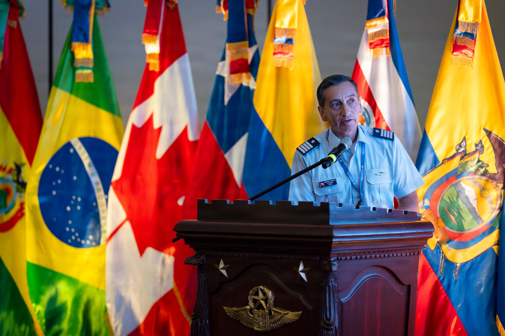 Chilean air force Col. Marcelo García, System of Cooperation Among the American Air Forces (SICOFAA) undersecretary general, provides remarks during the 66th annual Conference of the American Air Chiefs (CONJEFAMER) in Punta Cana, Dominican Republic, June 16, 2026. Established in 1961, SICOFAA promotes the exchange of experiences, knowledge and training to strengthen cooperative capabilities with a primary role in coordinating humanitarian assistance and disaster relief efforts. (U.S. Air Force photo by Tech. Sgt. Rachel Maxwell)