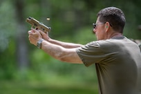 Photo of U.S. Air Force Maj. Gen. Henry Harder Jr., the adjutant general, Vermont National Guard, shooting his 9 mm Sig Sauer pistol at the Ethan Allen Firing Range in Jericho, Vermont.