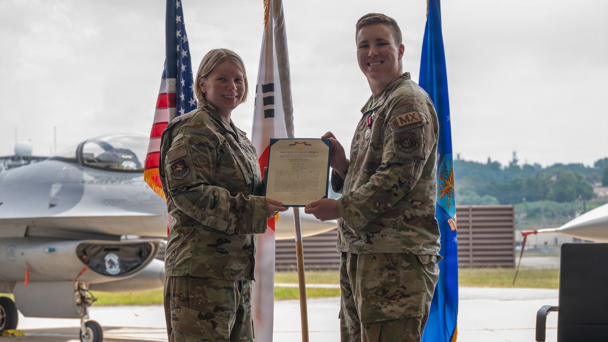 Airmen participate in a change of command ceremony at Osan.