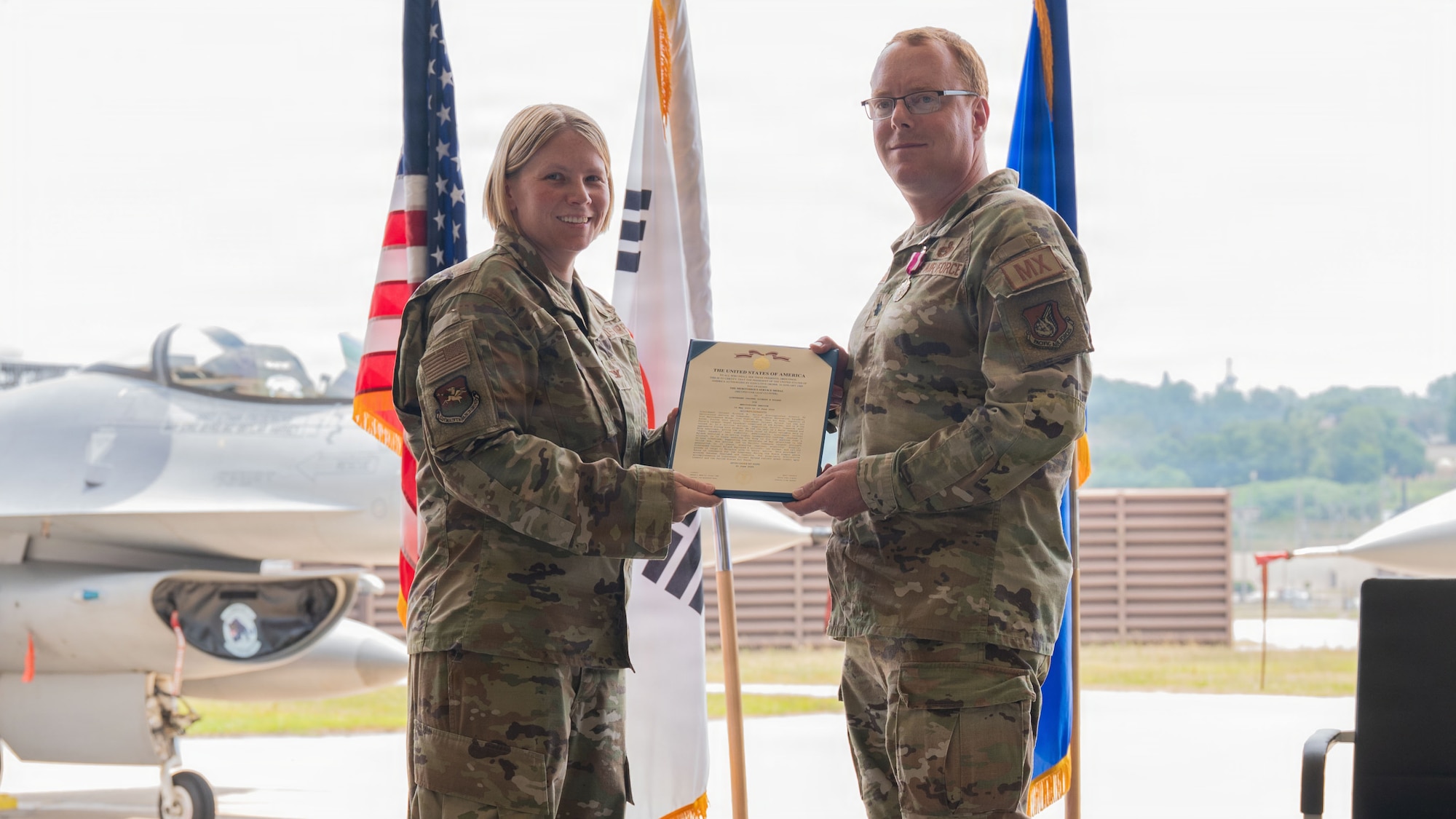 Airmen participate in a change of command ceremony at Osan.