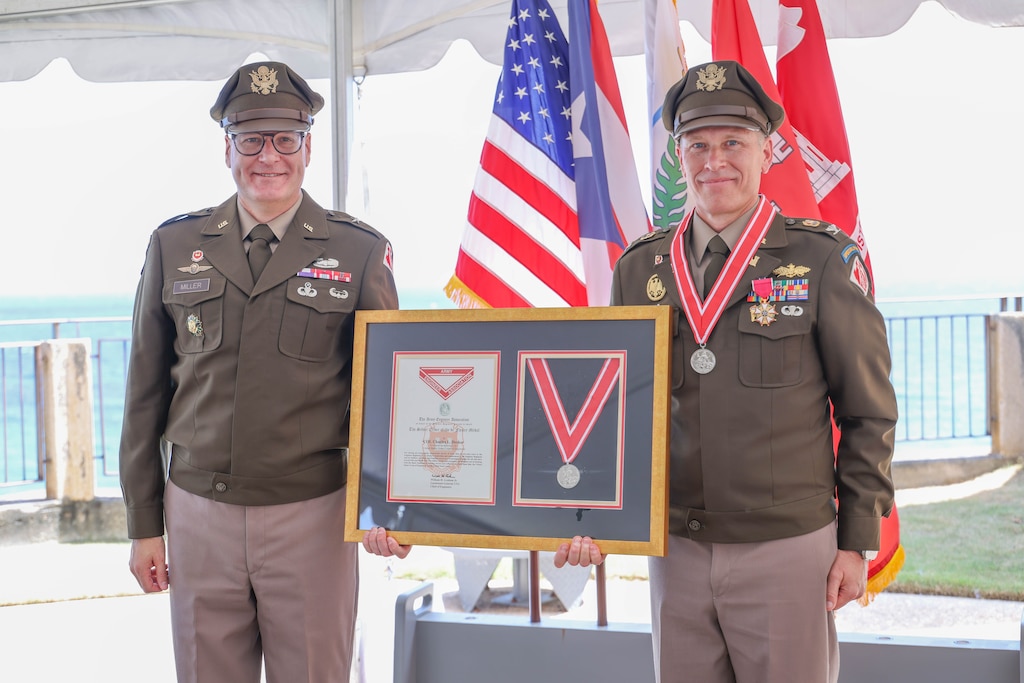 Brig. Gen. Zachary Miller, commander of the U.S. Army Corps of Engineers South Atlantic Division, presents the Silver de Fleury Medal to Col. Charles L. Decker during his retirement ceremony in San Juan, Puerto Rico. Decker, who was also awarded the Legion of Merit, led the district through some of the most significant infrastructure efforts in Puerto Rico and the U.S. Virgin Islands, including awarding the largest civil works contract in Puerto Rico’s history for the $1.078 billion Río Puerto Nuevo Flood Risk Management Project and completing the $56.7 million zero emissions deepening and widening of San Juan Harbor.