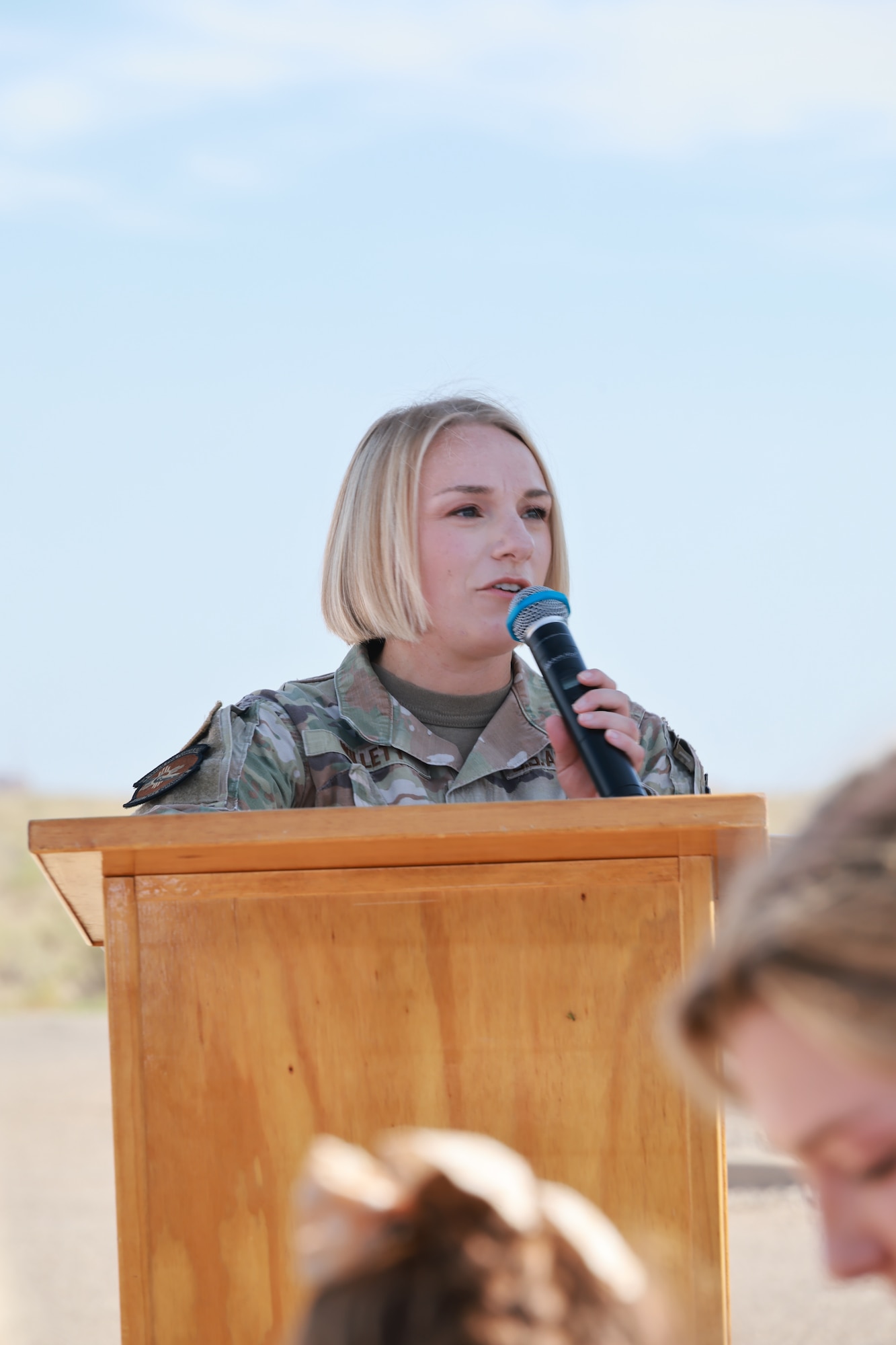 Lt. Col. Michelle Willett addresses attendees on hand to see her assume the role of 846th Test Squadron commander during a June 11, 2026, Change of Leadership ceremony at Holloman Air Force Base, N.M. The 846th TS is a unit of Arnold Engineering Development Complex. Prior to assuming the role of 846th TS Commander, Willett served as Director of Operations for the 445th Test Squadron within the 412th Electronic Warfare Group at Edwards Air Force Base, California. (U.S. Air Force photo by Ashleigh Ahrens)