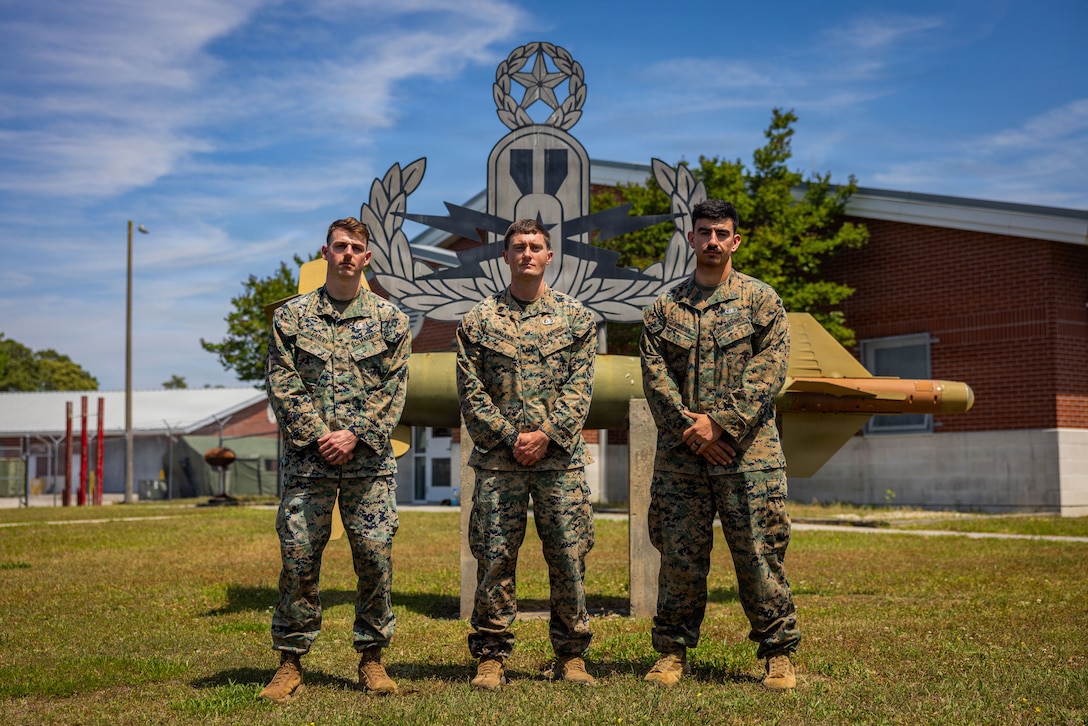 U.S. Marine Corps Sgt. Peter Earley, left, Staff Sgt. Joel Walker, center, and Sgt. Fred Aquilina, all explosive ordnance disposal technicians with 9th Engineer Support Battalion, 3rd Marine Logistics Group, pose for a group photo during the EOD Team of the Year competition at Marine Corps Base Camp Lejeune, North Carolina, April 16, 2026. The service level competition was hosted by 8th Engineer Support Battalion for more than 50 Marines to test individual and team skills in realistic scenarios and share tactics, techniques and procedures, with the winning team being recognized by the Congressional EOD Caucus. (U.S. Marine Corps photo by Sgt. Alfonso Livrieri)