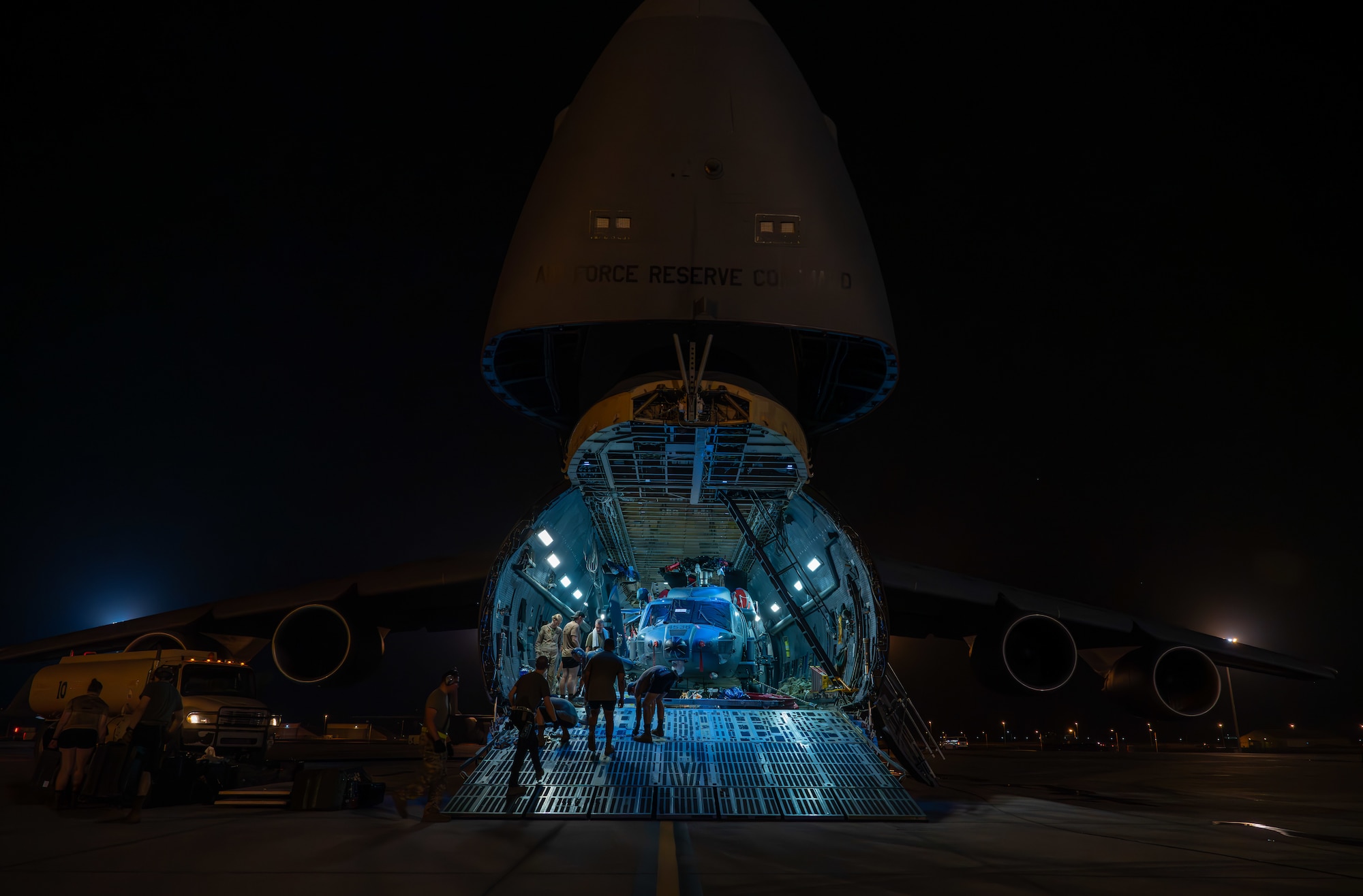 Helicopters being offloaded from a C-5 Galaxy