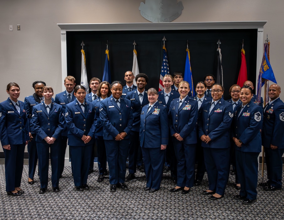 U.S. Air Force Lt Col. Tonya Toche-Howard, Goodfellow Operational Medical Readiness Squadron commander, right of center, stands with members of her new squadron to take a photo after her assumption of command ceremony at Goodfellow Air Force Base, Texas, June 17, 2026. The GOMRS welcomed Toche-Howard to their mission of readiness and trusted care everyday. (U.S. Air Force photo by Staff Sgt. Nathan Call)