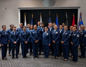 U.S. Air Force Lt Col. Tonya Toche-Howard, Goodfellow Operational Medical Readiness Squadron commander, right of center, stands with members of her new squadron to take a photo after her assumption of command ceremony at Goodfellow Air Force Base, Texas, June 17, 2026. The GOMRS welcomed Toche-Howard to their mission of readiness and trusted care everyday. (U.S. Air Force photo by Staff Sgt. Nathan Call)