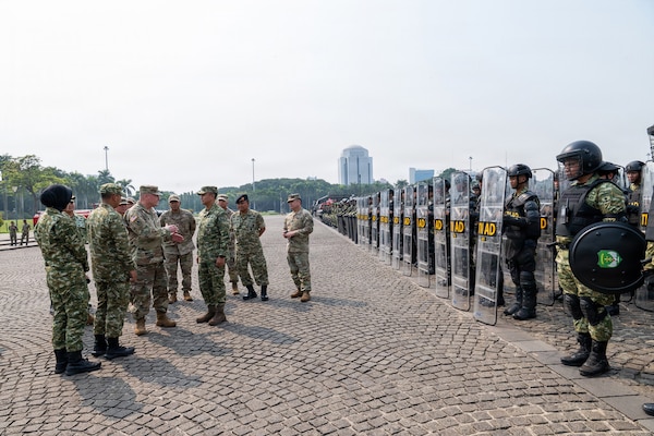 U.S. Army Maj. Gen. Stephen F. Logan, adjutant general of the Hawaii National Guard, and members of the Hawaii National Guard delegation receive a capabilities briefing from Indonesian Army leaders during a riot control equipment demonstration at the National Monument in Jakarta, Indonesia, June 11, 2026.