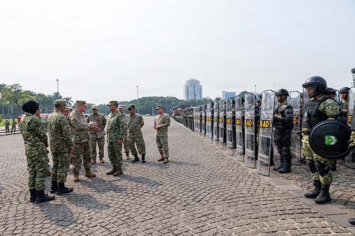 U.S. Army Maj. Gen. Stephen F. Logan, adjutant general of the Hawaii National Guard, and members of the Hawaii National Guard delegation receive a capabilities briefing from Indonesian Army leaders during a riot control equipment demonstration at the National Monument in Jakarta, Indonesia, June 11, 2026.