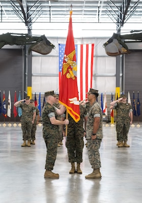 Lt. Col. Andrew J. Martin receives the Headquarters Battalion colors during a change of command ceremony at Marine Corps Logistics Command, Marine Corps Logistics Base Albany, Georgia, June 23, 2026. The ceremony marked the official transfer of authority and responsibility from Lt. Col. Jason A. Paredes to Martin.