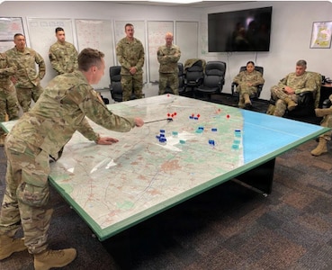 Students review courses of action as part of the 640th Regiment Regional Training Institute’s battle staff course Camp Williams, Utah.