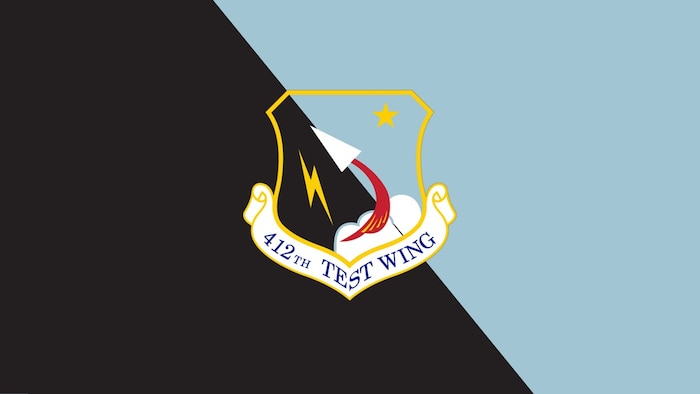 The official 412th Test Wing shield is depicted on a blue and black background. (U.S. Air Force graphic)