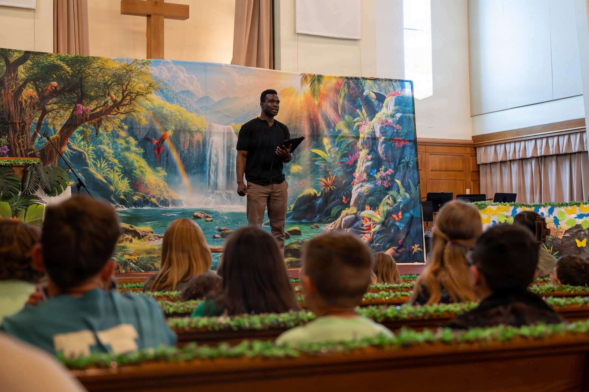 Capt. Daniel Camara, 377th Air Base Wing chaplain, introduces the day’s lesson to children during the Kirtland Chapel Vacation Bible School at Kirtland Air Force Base.