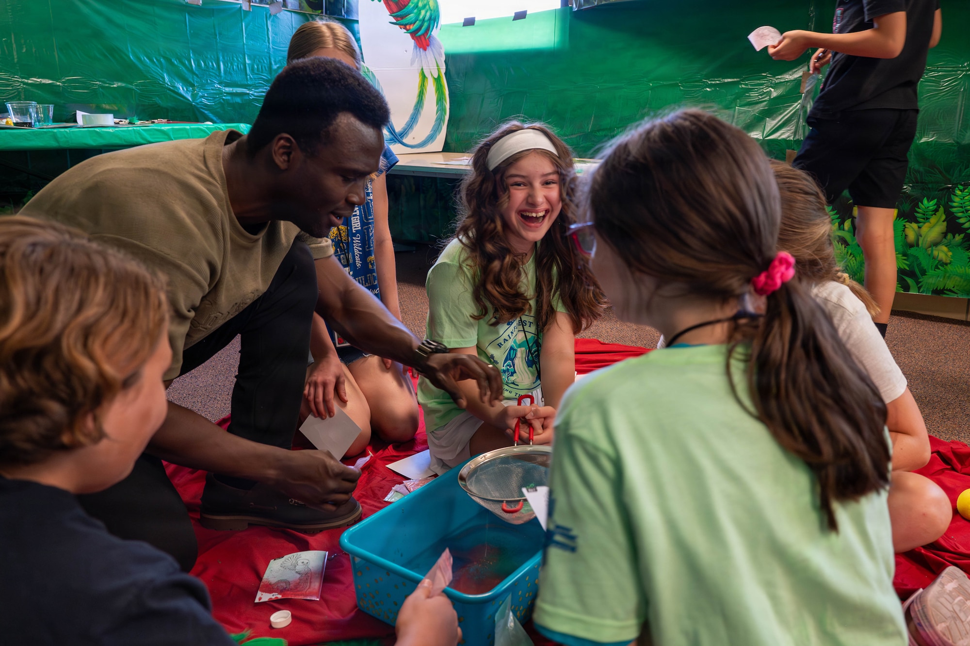 Children engage in a team-building activity during Kirtland Chapel Vacation Bible School at Kirtland Air Force Base.