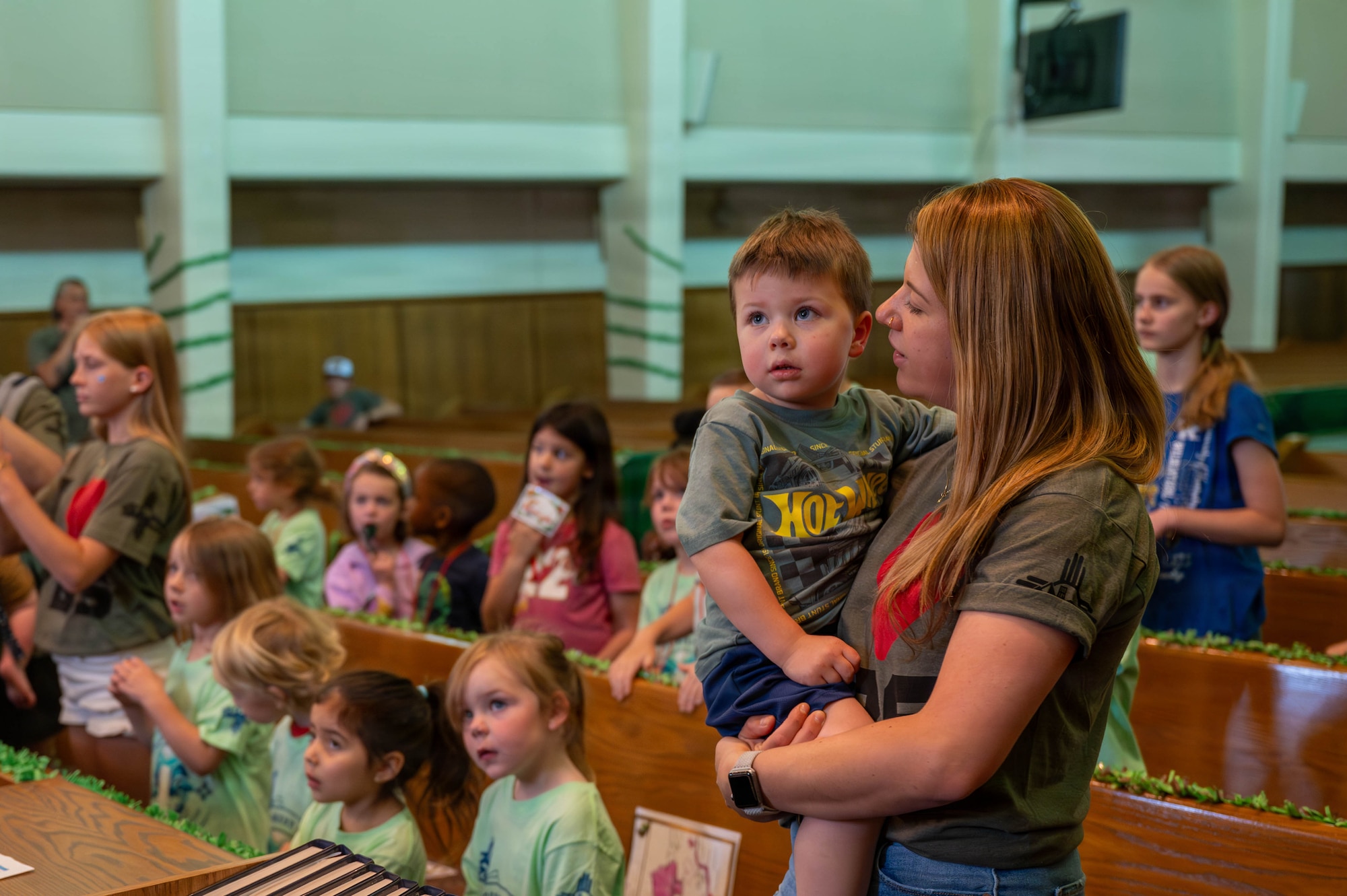 Attendees of the Kirtland Chapel Vacation Bible School sing along to music at Kirtland Air Force Base.
