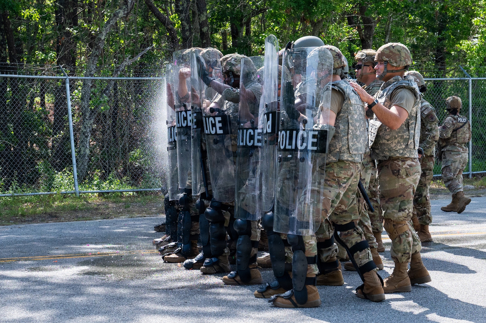 Photo of ANG Airmen performing their jobs during a military exercise.